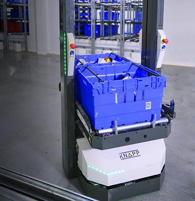 AMR from KNAPP operating in a distribution center, showcasing intelligent autonomous navigation that supports flexible micro‑fulfillment, reduces manual movement, and increases overall warehouse efficiency.