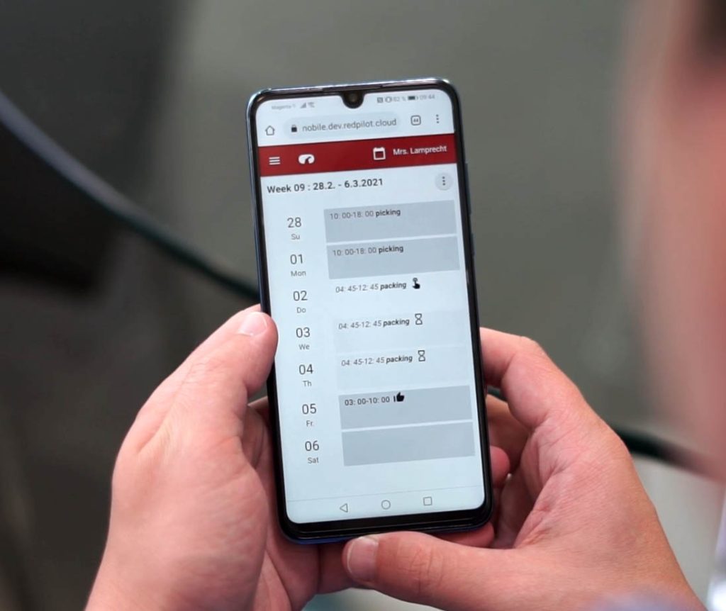 handheld device displaying the redpilot interface for real‑time optimization and decision support in warehouse operations