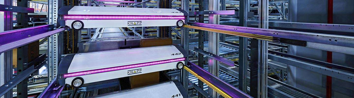 KNAPP shuttle systems in motion inside the warehouse, demonstrating high‑density storage, fast retrieval, and space‑efficient automation that maximizes throughput within the existing footprint.