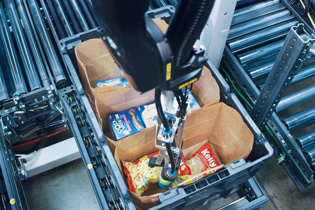 Pick-it-Easy Robot handling food items in an automated fulfillment process using KNAPP intelligent vision and robotic picking technology.