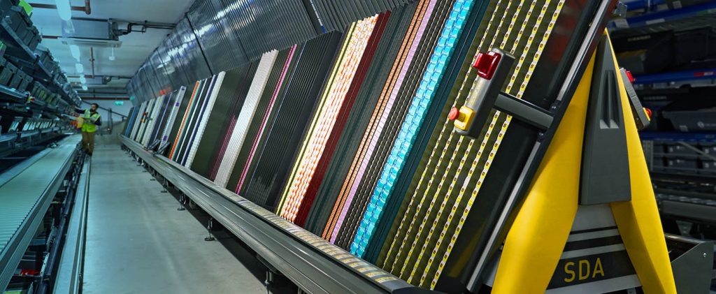 a‑frame automated dispensing system rapidly picking high‑volume pharmaceuticals and small items to improve accuracy, labor efficiency, and overall throughput in wholesale distribution.