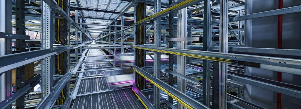 knapp shuttle racking system storing and sequencing totes with high density and speed to maximize space efficiency, throughput, and flexibility in modern automated distribution centers.