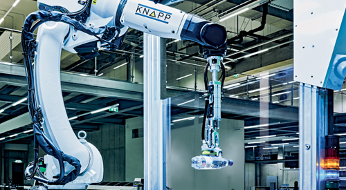 pick-it-easy robot gripping a water bottle to demonstrate precise item handling and reliable robotic picking performance in modern fulfillment operations.
