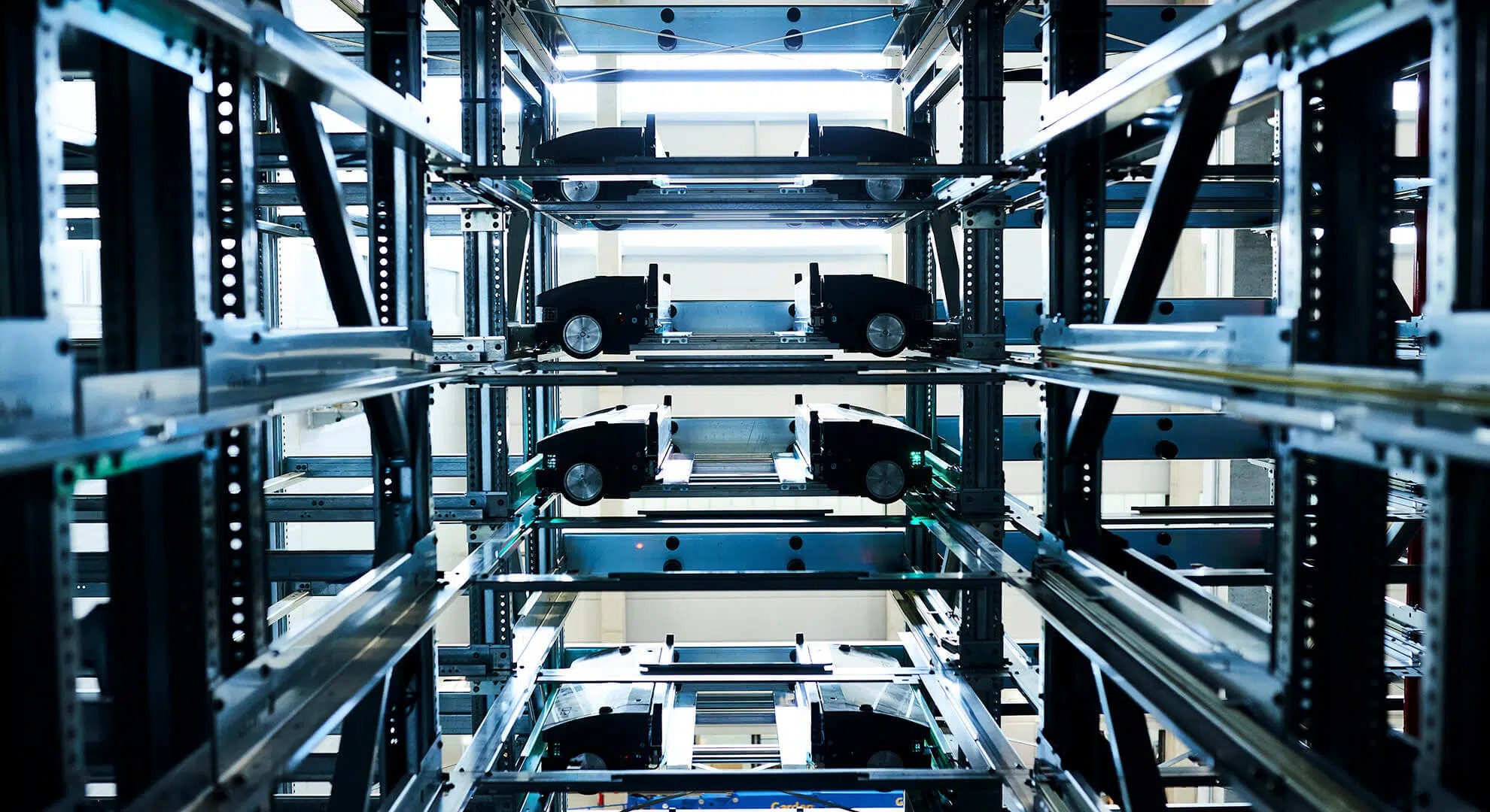 High-performance shuttle systems operating within the Schukat electronic components distribution center, highlighting automated storage, fast order handling, and space‑efficient inventory management powered by KNAPP technology.