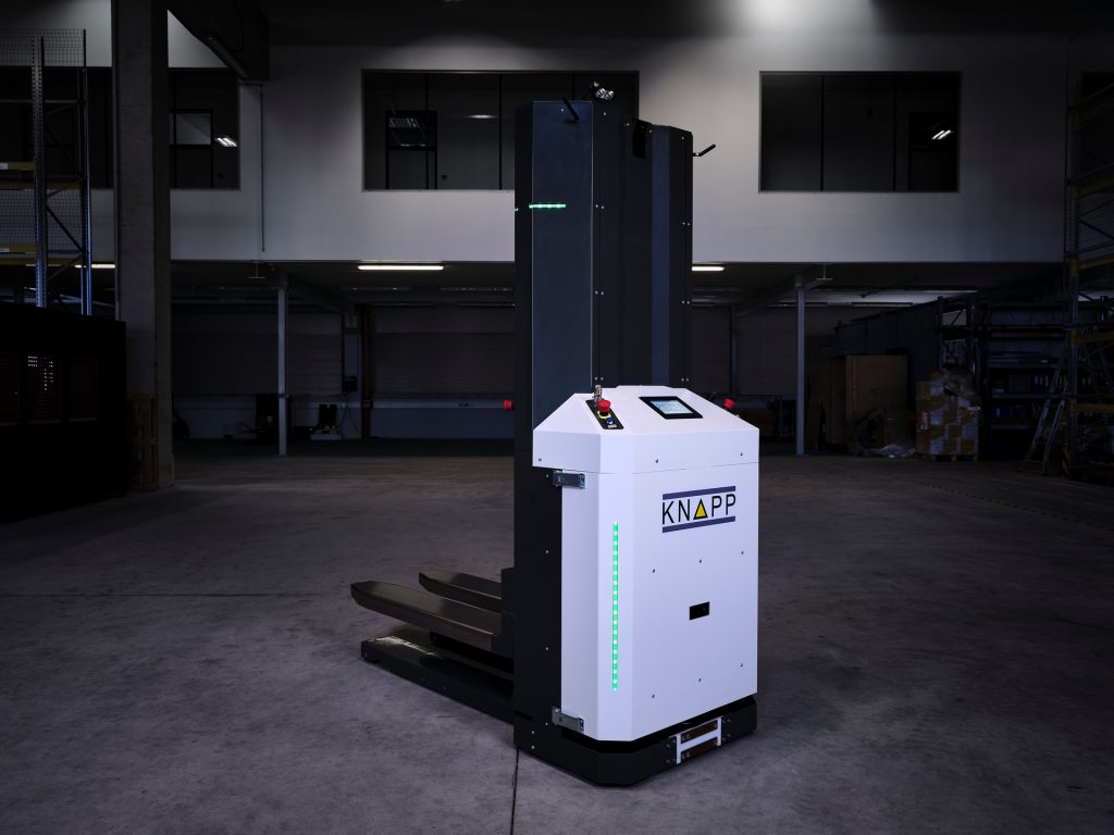 KNAPP autonomous mobile robots moving full pallets through an automated warehouse, illustrating high‑capacity transport, precise navigation, and seamless integration with intralogistics workflows for efficient material handling.